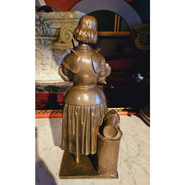 Joan of Arc in prayer, finely chiseled bronze with brown patina, old cast iron from the 19th century with her sword and...