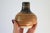 Vintage studio art pottery bud vase in earth tones. Signed by artist on bottom. Minor age wear. No chips or cracks.