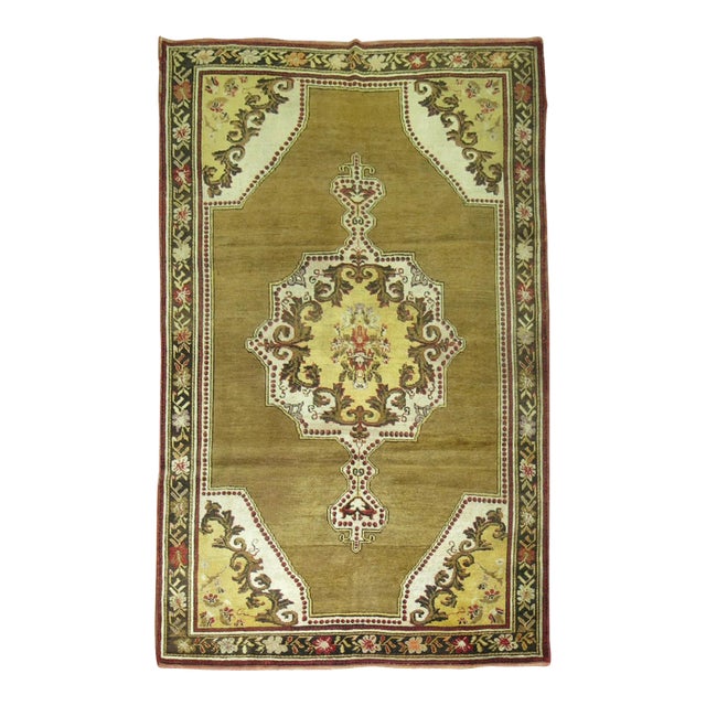 Early 20th Century Olive Brown Yellow Turkish Medallion Ghiordes Rug - 4'6" x 6'6" For Sale