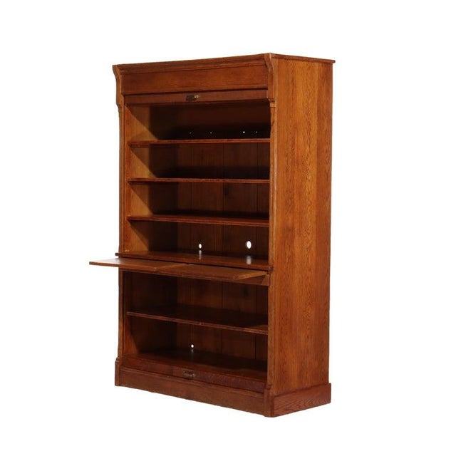 Oversized Antique Oak Roll Front Bookcase C1920 Measures - 75.25"H x 47.25"W x 20.75"D This oversized antique oak roll...