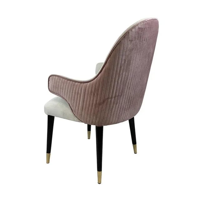 Armchair at the head of the table in pink and white velvet with black lacquered wooden feet and brass finish Dimensions...