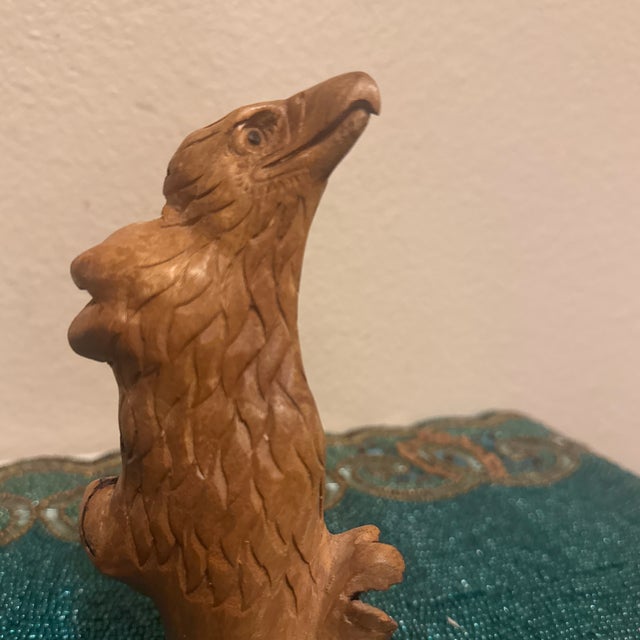 This exceptional vintage mid-century sculpture captures the striking profile of an eagle, masterfully hand-carved from a...