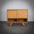A clean and functional sideboard by czech designer jiří jiroutek, known for his elegant storage furniture and refined use...