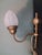 A very beatiful Art Noveau light ,wall lamp ,made in france with brass holder and floreal typical Art Noveau style smoked...