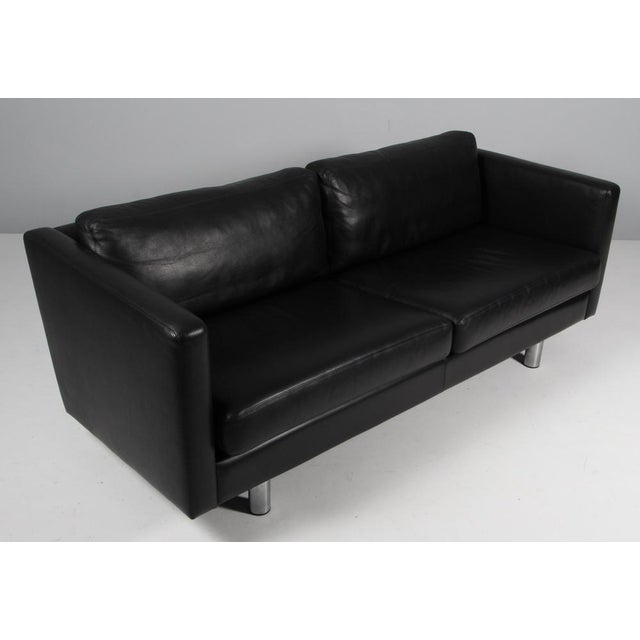 Erik Jørgensen three-seat original upholstered with black leather Legs of aluminium. Made by Erik Jørgensen. This piece is...
