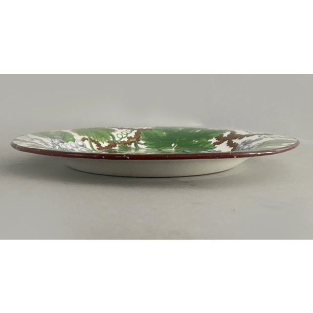 Spode pearlware dessert plate, the edge outlined in brown and the body decorated with clusters of bluish grapes, leaves...