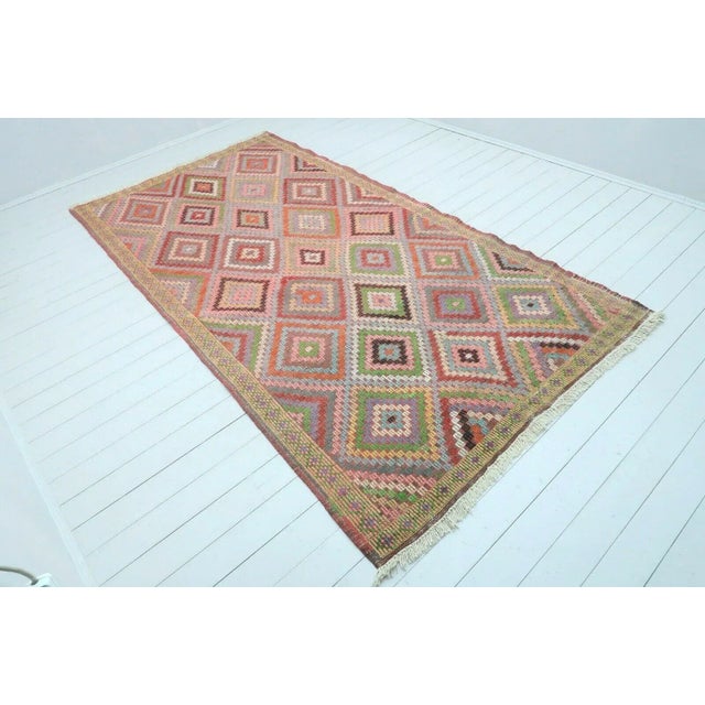 This beautiful, vintage, handwoven kilim is approximately 60 years old. It is handmade of very fine quality wool and...