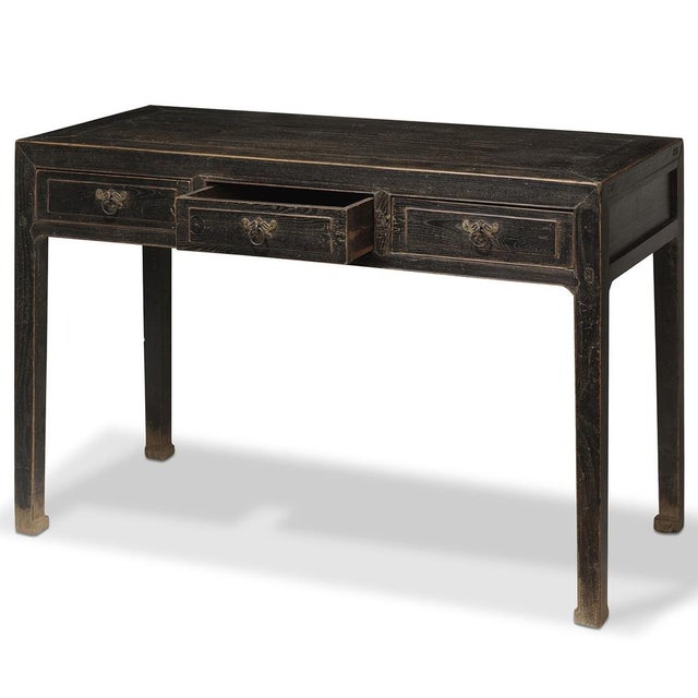 This Beijing desk from the early 1900s has a deep and practical design with horse hoof shaped feet and three good-sized...