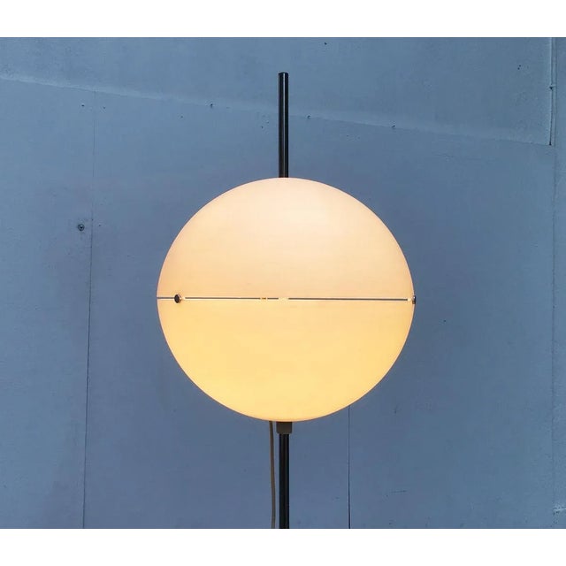 Rare Space Age floor lamp with height-adjustable ball. A small but impressive object. A luminous ball on a pole. The large...