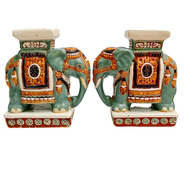 Pair of ceramic glazed elephant pedestals or bookends. Chinoiserie-inspired and rich in detail, they are finished in a...