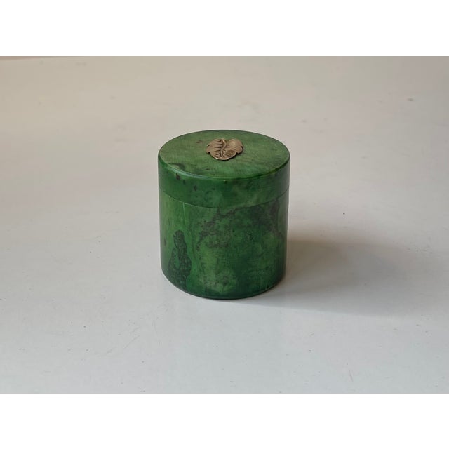 A small stylish Italian jar with gold leaf decor to its lid. It was hand-tooled in Italy during the 1940s. Measurements:...