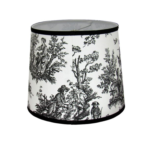 This black toile drum shade exudes timeless sophistication with its intricate pastoral design. The bold black pattern on a...