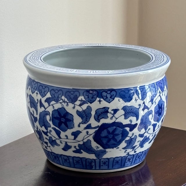 Offering a lovely petite Chinoiserie fishbowl-style blue & white porcelain cachepot or planter from the 1980s. Gorgeous...