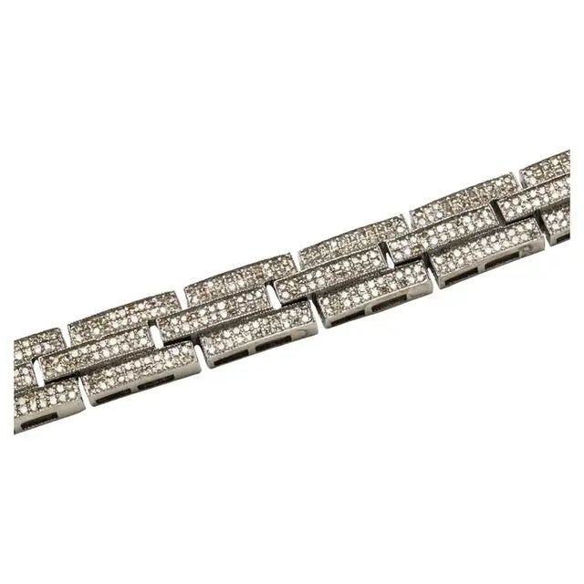 A lovely link bracelet in a geometric design set with a multitude of round, brilliant cut diamonds in a pave` setting. Set...
