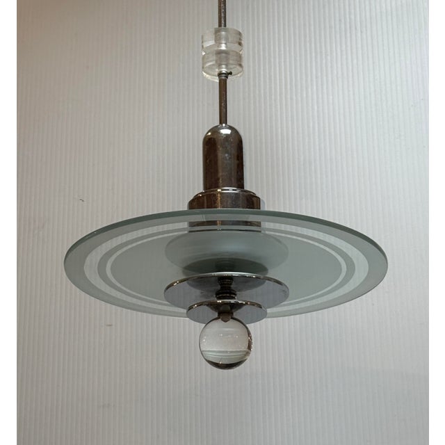 Design Plus Gallery presents a Vintage Art Deco Saturn Etched-Glass + Chrome-Plated Chandelier. The fixture showcases a...
