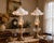 A charming pair of antique white milk glass hanging smoke bells featuring gracefully ruffled rims and integral glass...
