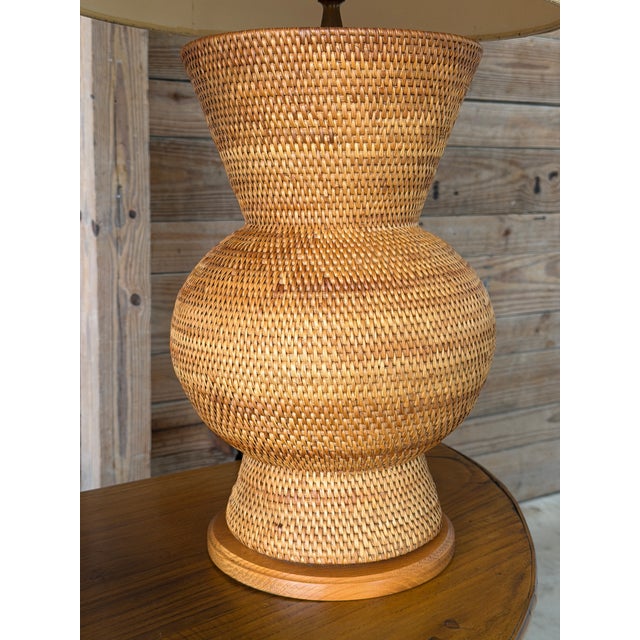 Some things simply deserve to remain exactly as they have survived. This exceptional pair of vintage hand-woven rattan...
