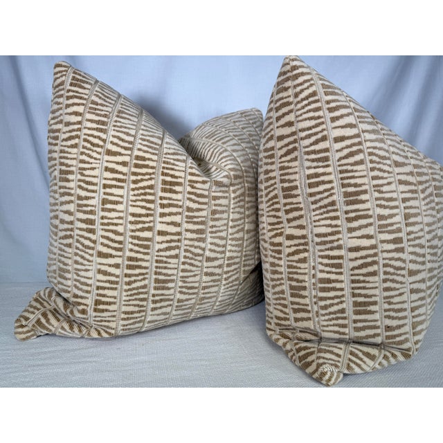 Custom pair of 22" pillows covered in Cowtan & Tout "Mandara" in color sand. These pillows have tapered corners to prevent...
