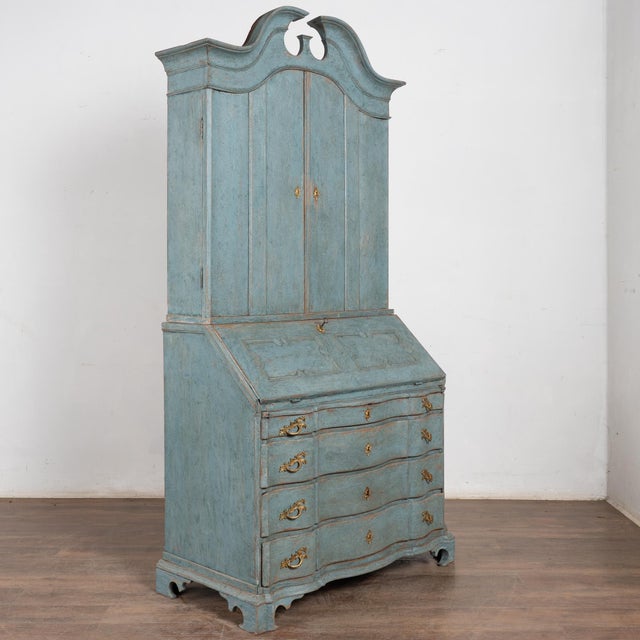 This oak secretary is a striking statement piece with panel doors, dramatic bonnet, and traditional lower three large...