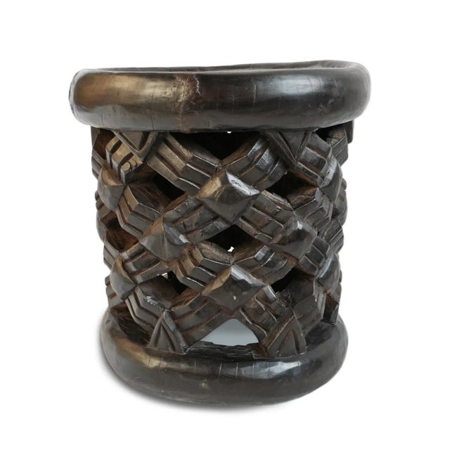 Authentic hand carved vintage Bamileke tribal wood stool. Masterfully crafted from one piece of indigenous wood....