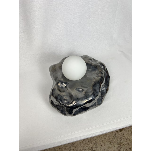 Carefully handcrafted wall sconce from terracotta with frosted glass globe. Glazed exterior i manual technique. supply:...