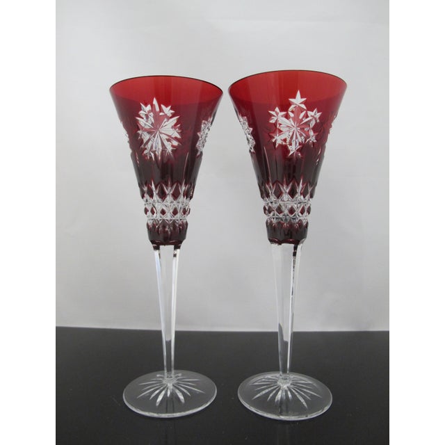 Stunning Waterford crystal champagne flute set of 2 glasses in Snowflake Crystals pattern. Vibrant ruby red crystal bowl...