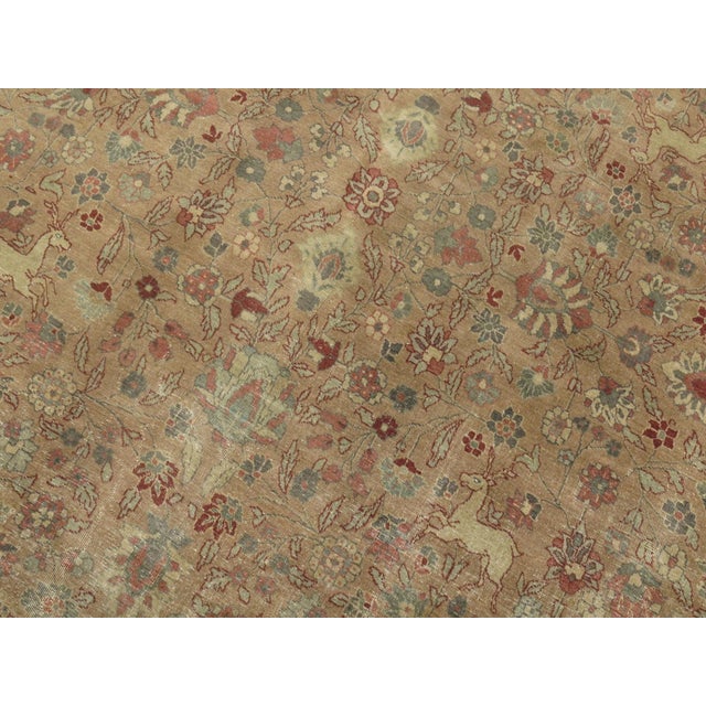 Room size Persian Pictorial Tabriz rug on a light brown colored ground, circa 1920