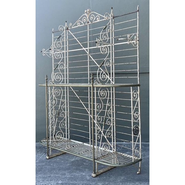 This monumental vintage baker’s rack is a breathtaking celebration of French provincial charm and Hollywood Regency...