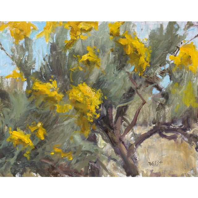 Sunny Chamisa captures the vibrant yellow blooms of the chamisa plant against a backdrop of soft, muted greens and blues....