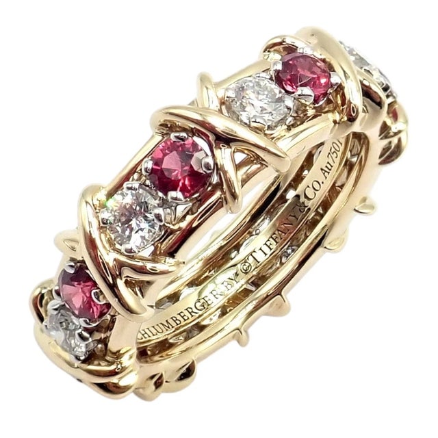 Crafted in 18k gold and platinum, this Tiffany & Co. Schlumberger 16 Stone band ring features alternating round brilliant...