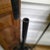 1920s French hand-worked iron hall tree with revolving hooks, rose appliques, and an umbrella or cane corral. Created as...