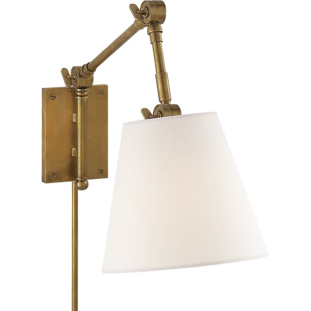 Suzanne Kasler for Visual Comfort Signature Graves Pivoting Sconce in Hand-Rubbed Antique Brass with Linen Shade For Sale