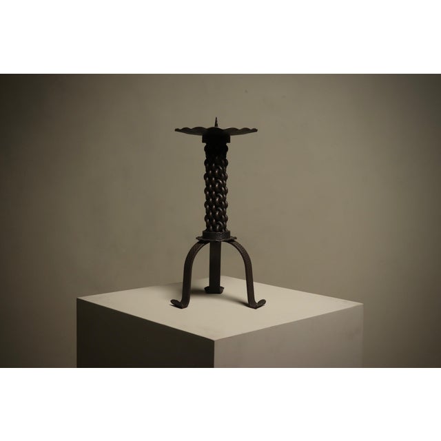 Heavy brutalist candle holder from the 1960s, executed in solid wrought iron. This sculptural piece embodies the raw,...