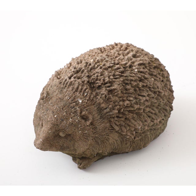 This delightful reconstituted stone hedgehog garden ornament adds a touch of whimsy and charm to your outdoor decor. This...