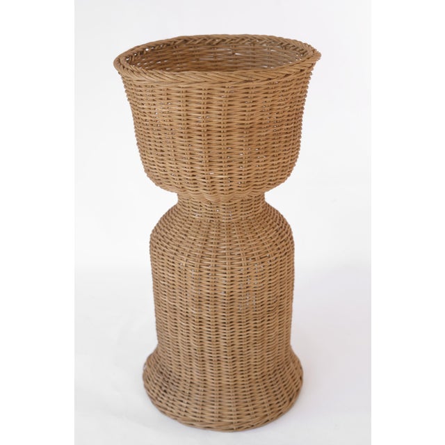 Charming vintage 70s pedestal wicker plant stand made of rattan. It should be able to hold a planter what is around 13"...