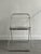 Set of 7 "plia" chairs by Giancarlo Piretti for Anonima Castelli, 1970s. Metal frame with transparent acrylic glass seat...