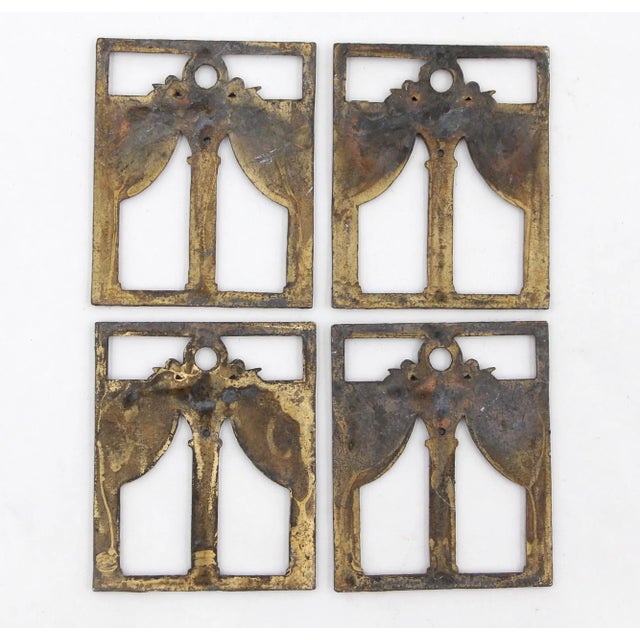 Set of bronze decorative appliques featuring a classical architectural design. The design includes two columns supporting...