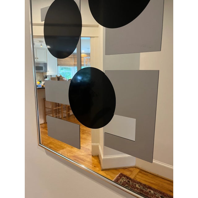 1970’s Op-Art mirror with grey and black geometric shapes by Turner. A great addition to a gallery wall or can stand...