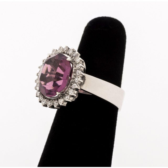 Purple Gemstone, Diamond, and 10K White Gold Ring, featuring one prong set oval purple faceted gemstone approx. 12 x 10...