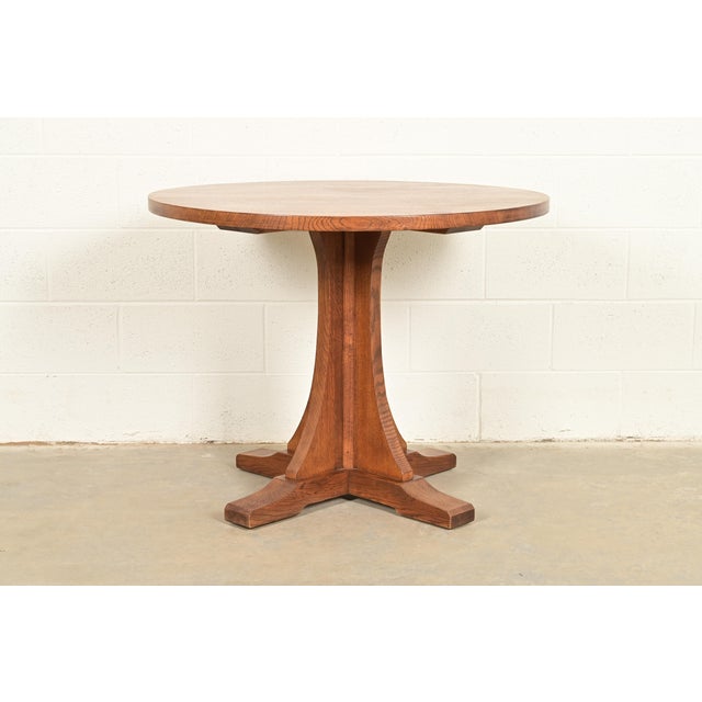 A gorgeous Mission oak Arts & Crafts pedestal center table, breakfast table, or game table By Stickley USA, 2000 Measures:...