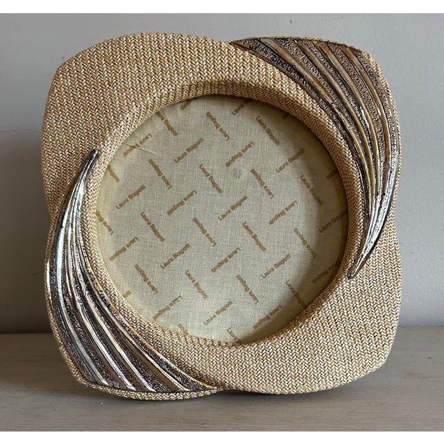 Beautiful vintage sculptural wicker and silver round table top picture frame by Laura Biagiotti. Classic, elegant design,...
