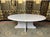 Beautiful oval coffee table entirely made of white Carrara marble with grey and pink veining, from Italian production of...