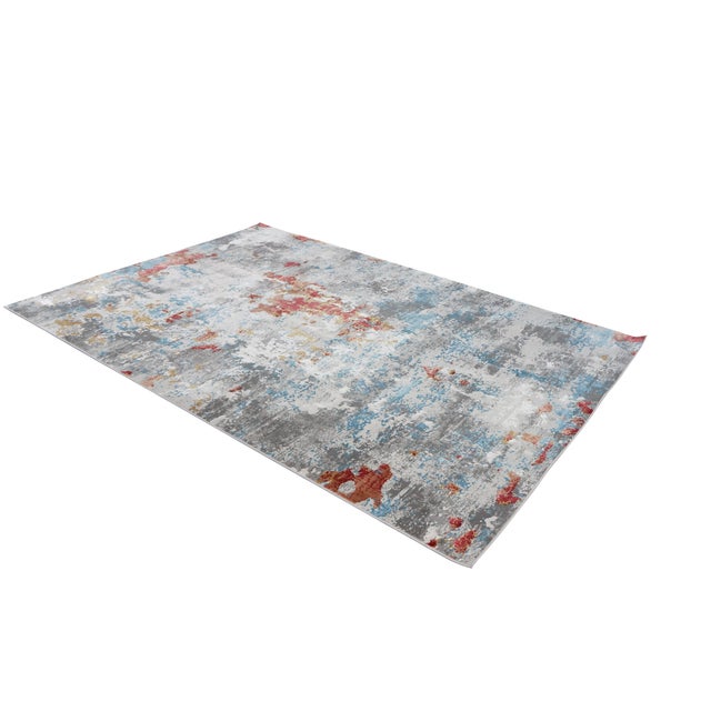 The Millenia MLL-20 area rug, measuring 5'3" x 7'7", showcases a contemporary, distressed abstract design characterized by...