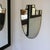 Vintage italian brass shield-shaped mirror, made in the 1950s-1960s, in the spirit of post-war italian design. its shield-...