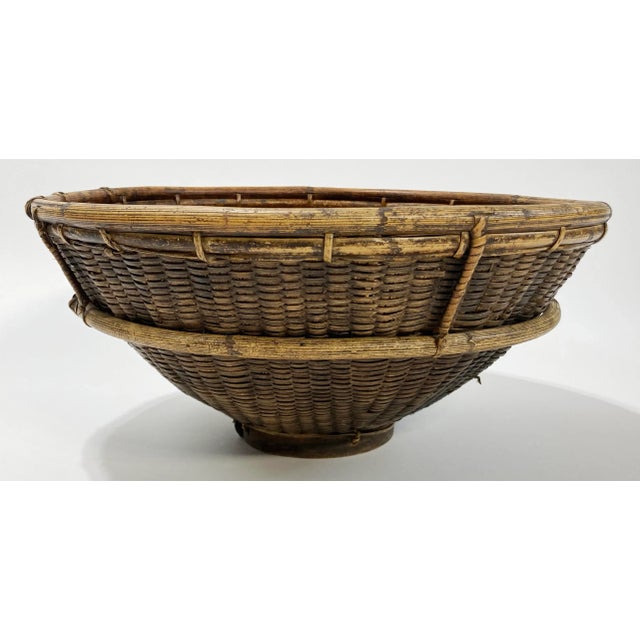 Large vintage well-made basket for carrying rice and other food. Made of tightly woven wicker with bamboo framing for...