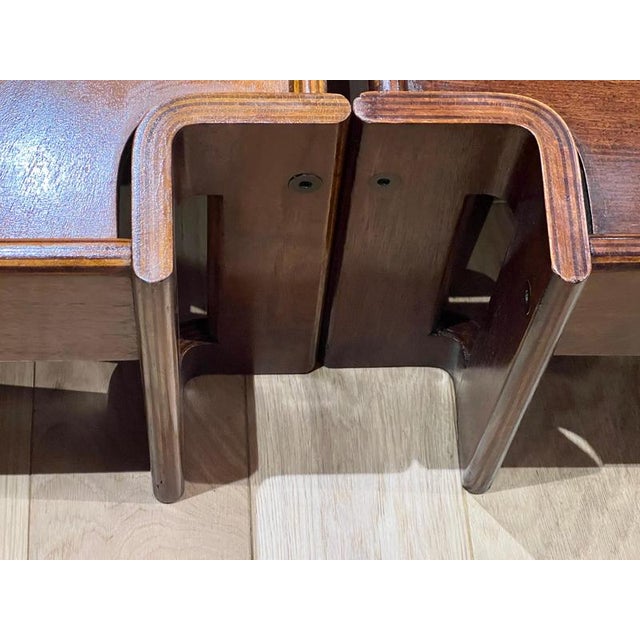 A fine set of three geometric design modular coffee table in alternate dark and honey wood veneer finish . The set...