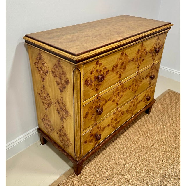 A sophisticated painted chest of drawers by Baker Furniture from the respected Milling Road collection, featuring a warm...