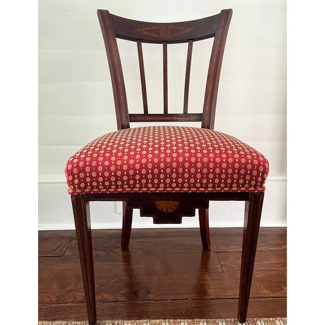 This beautiful, early 19th century French Empire chair is crafted of mahogany with delicate, unusual inlay. It appears to...