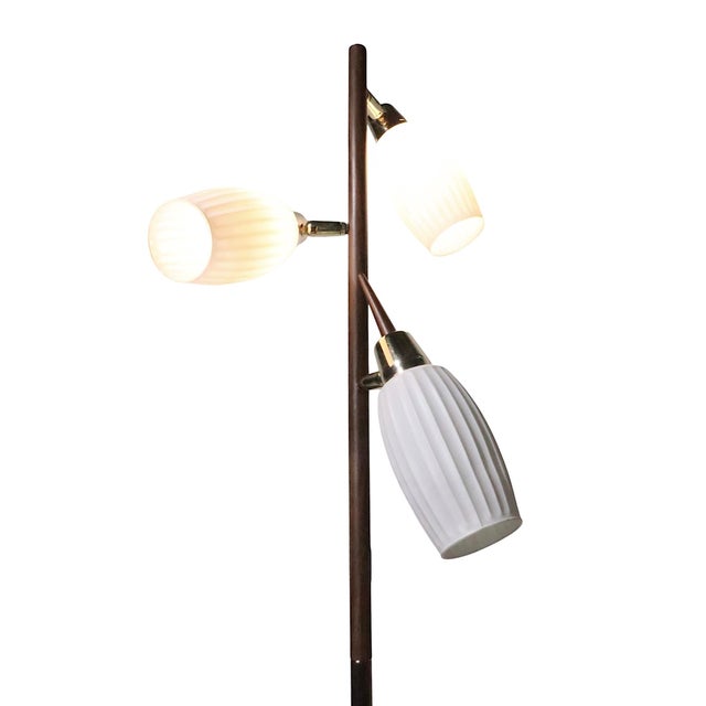 Classic Mid Century three light pole lamp, in good, original, clean and working condition. The lamp features three...