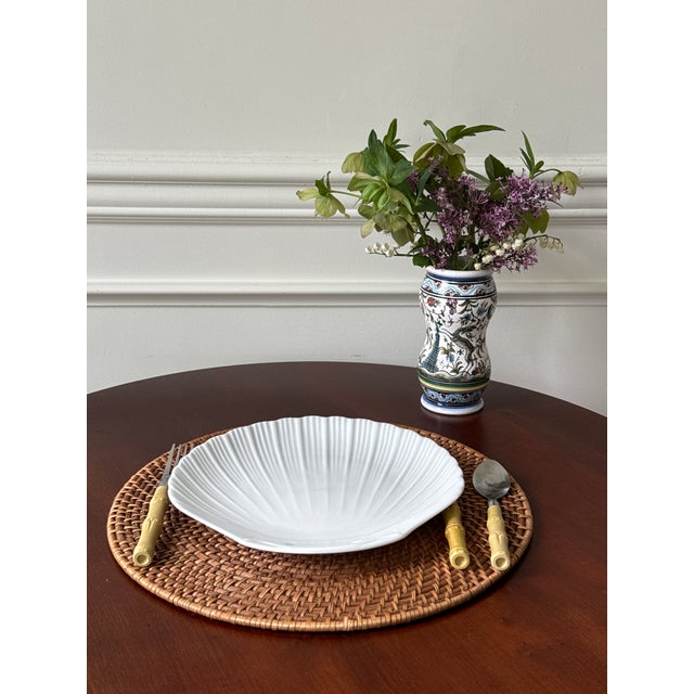 White ceramic dinnerware pieces are timeless and classic. This set of four shell shaped plates are by Apilco, the historic...